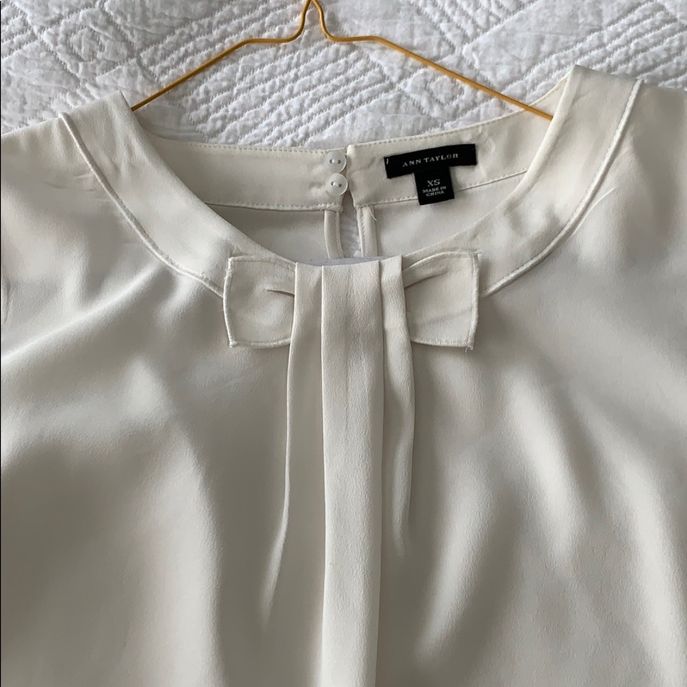 Ann Taylor cream sleeveless blouse